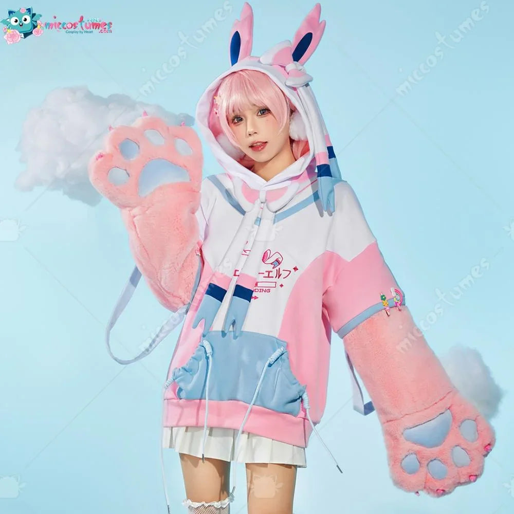 A person in a pink and white cosplay hoodie with fur cat paw gloves and bunny ear hood