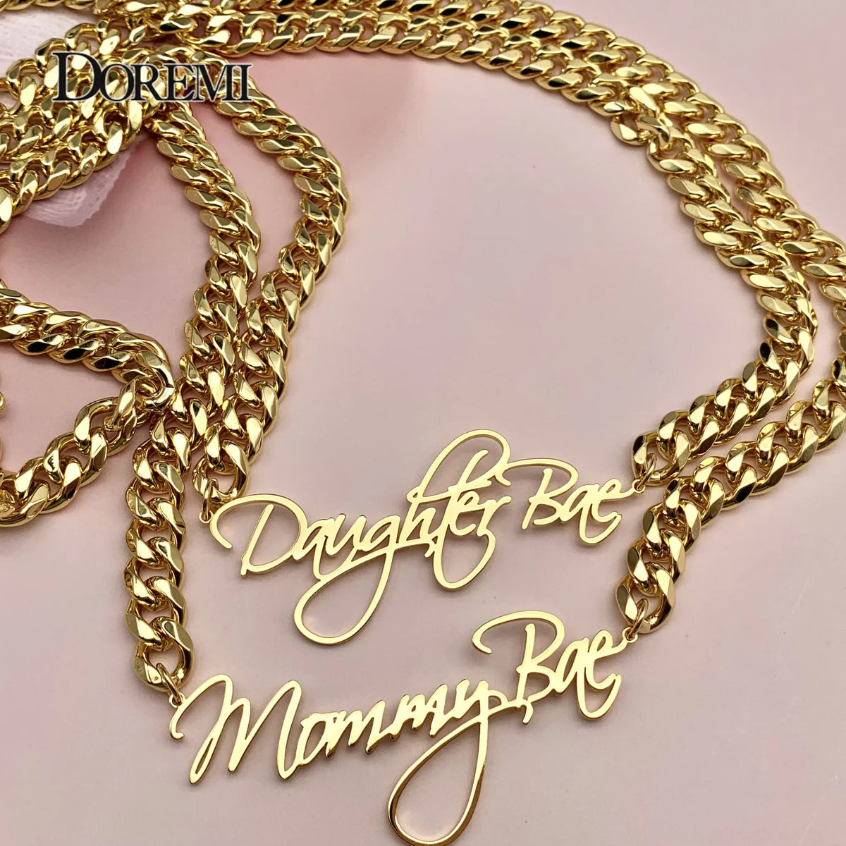 Gold custom nameplate necklaces with thick cuban chains
