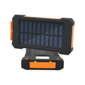 Rugged black and orange portable solar power bank with USB port cover