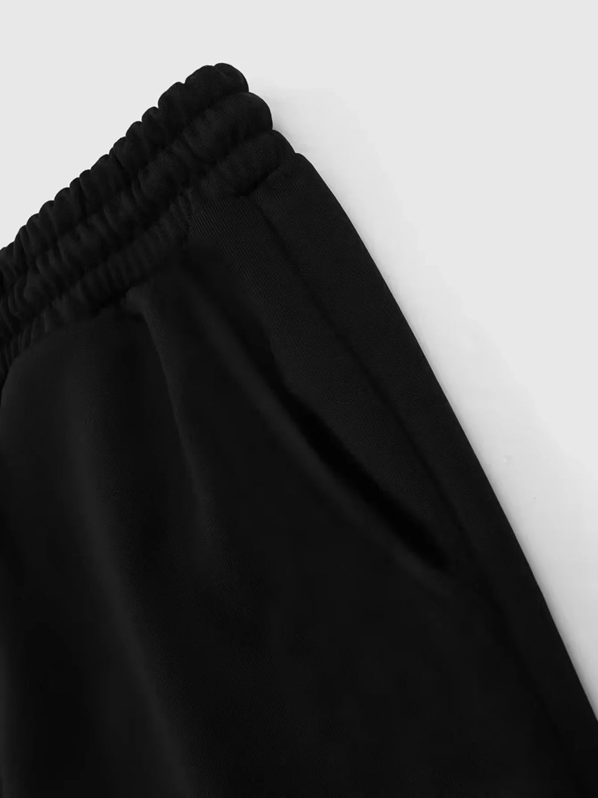 Close-up of black sweatpants side pocket