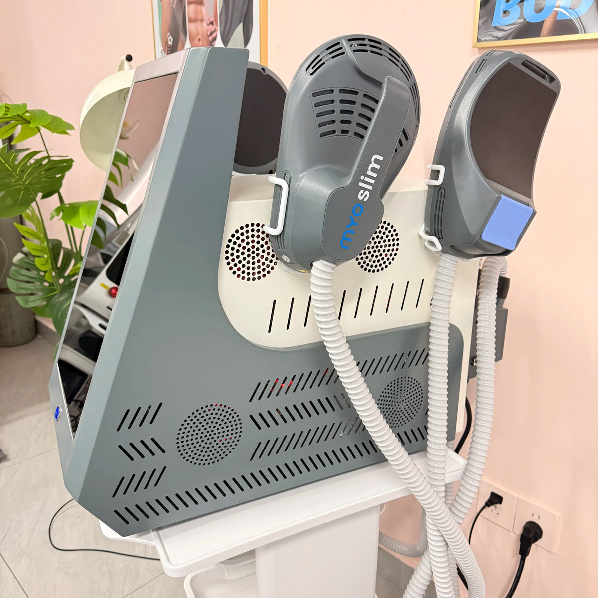 Professional body contouring device with handpieces in a clinic setting