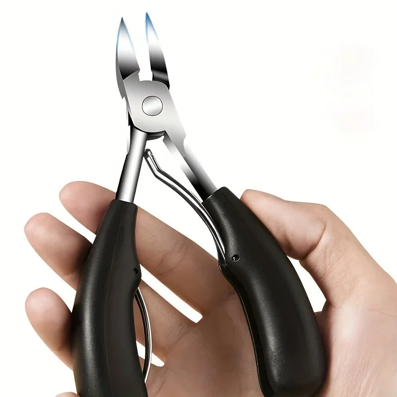 Stainless steel toenail nippers with black rubber handles held in a hand