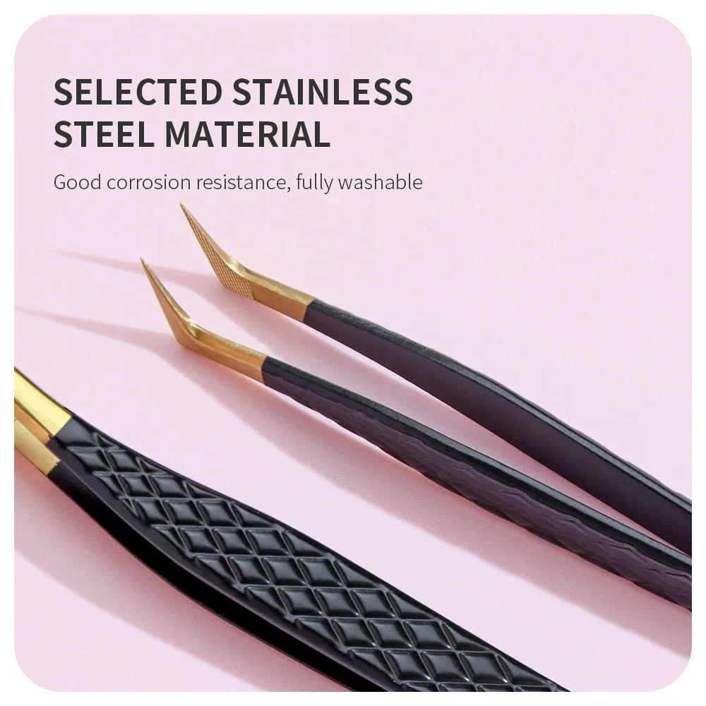 Close up of black and gold stainless steel eyelash tweezers with a textured grip