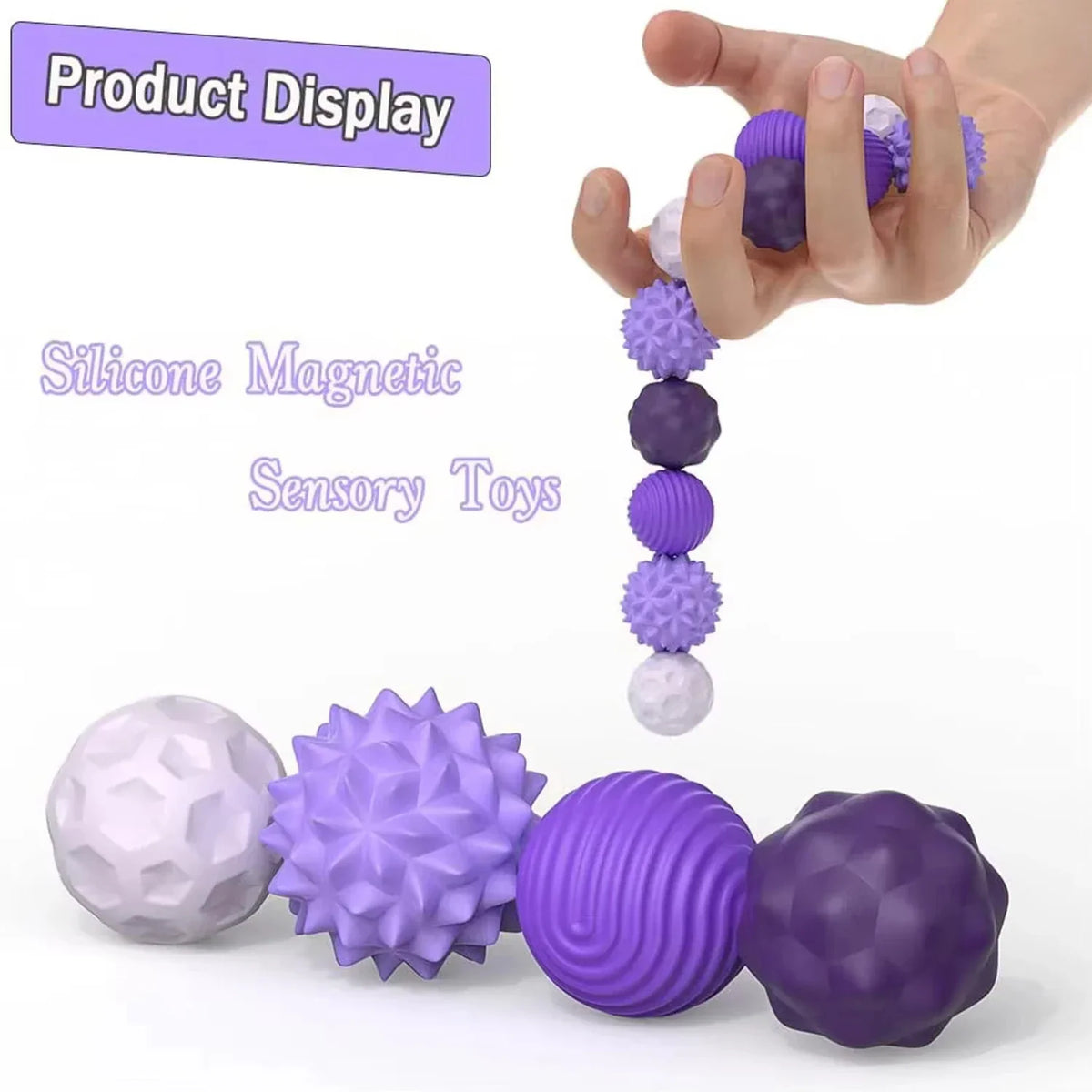 Hand holding magnetic purple sensory fidget balls with various textures.