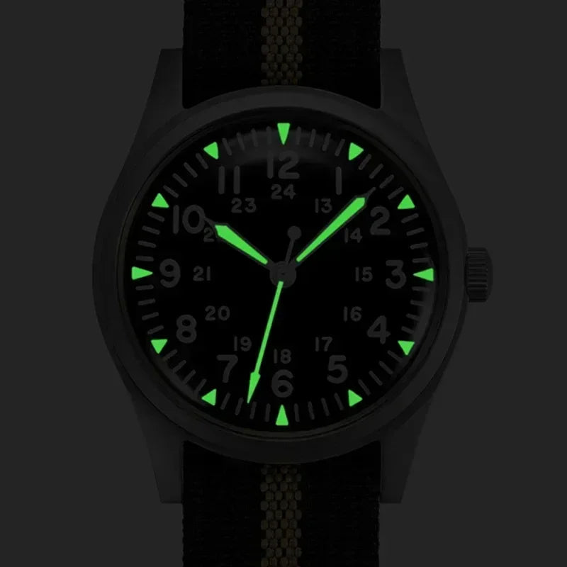 Luminous dial and hands of a military style field watch in the dark