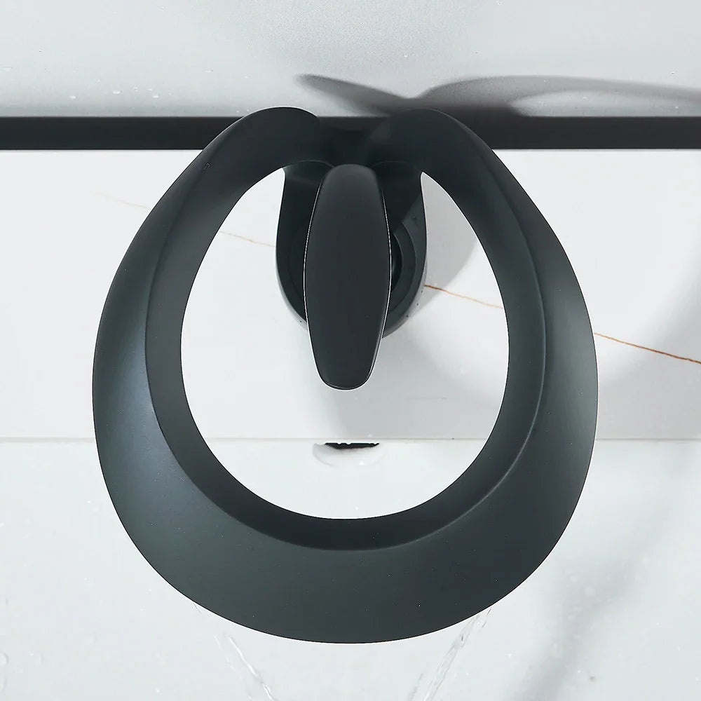 Top view of a matte black waterfall basin faucet