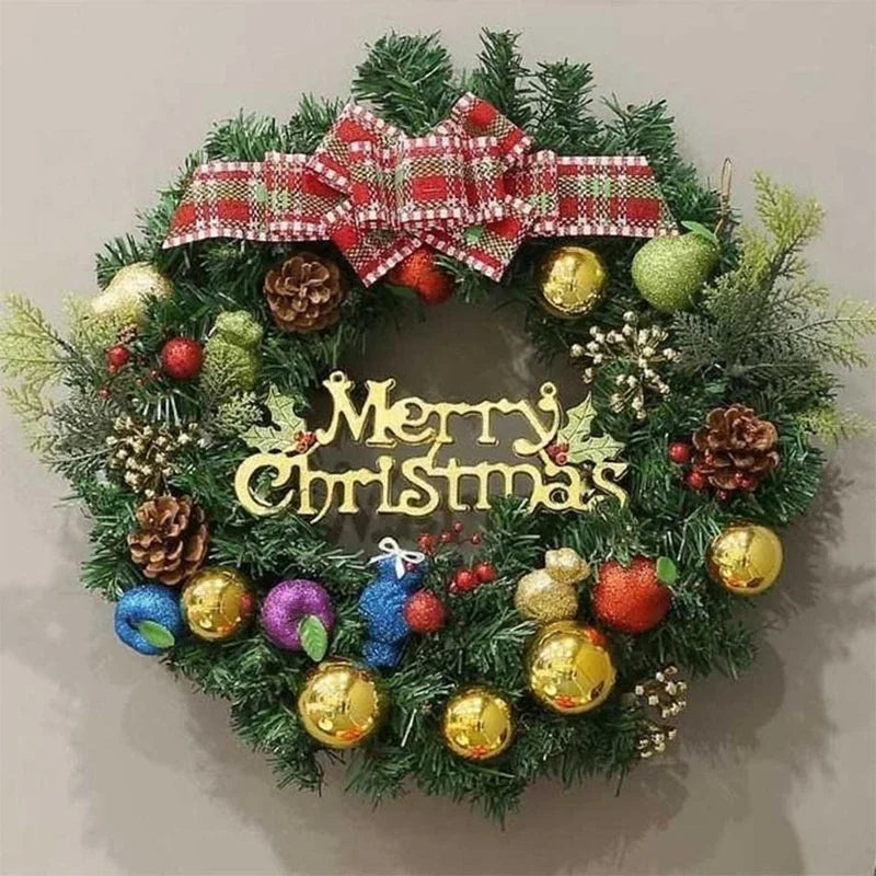 Christmas wreath with Merry Christmas sign, pinecones, berries and baubles