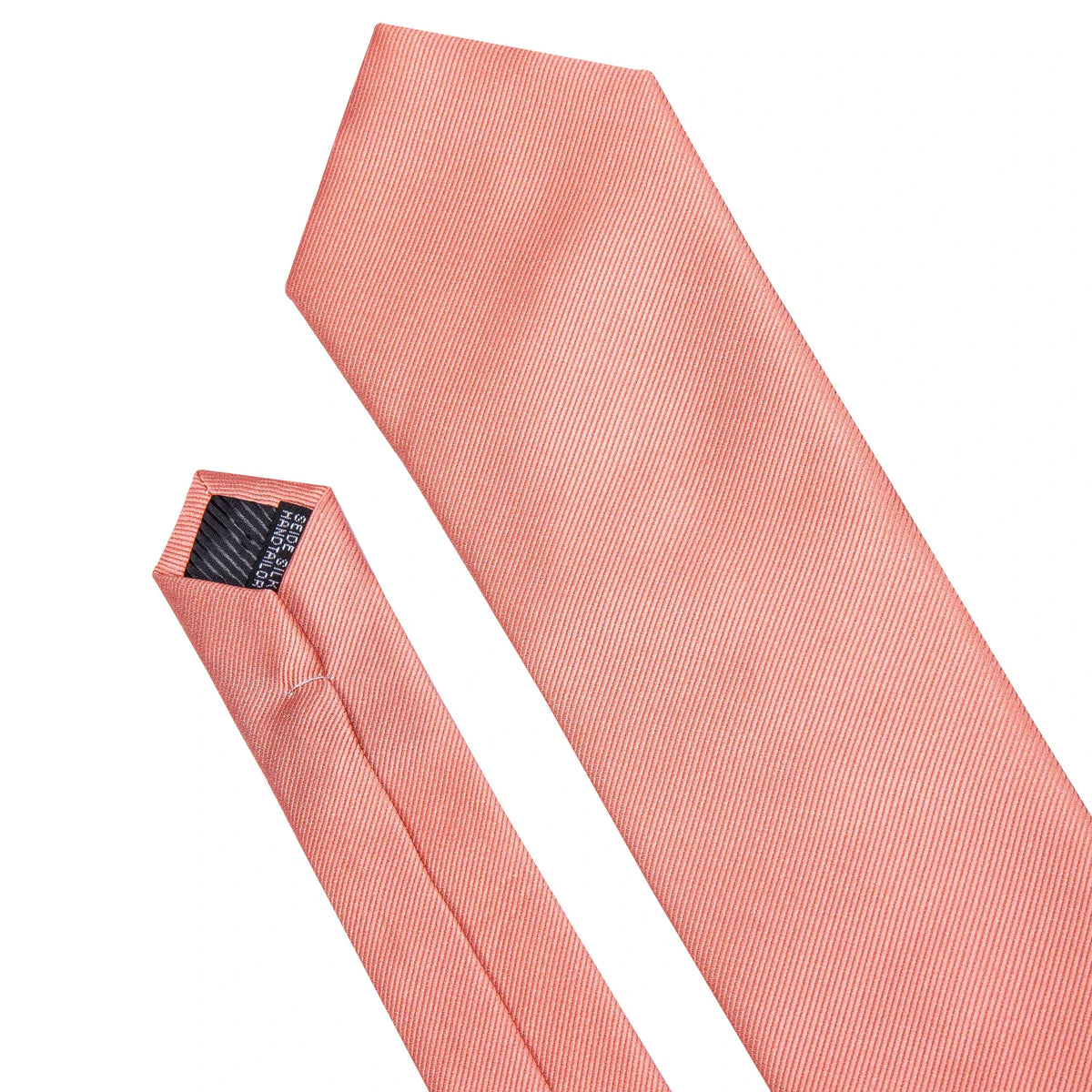 Close-up of a textured coral pink silk necktie