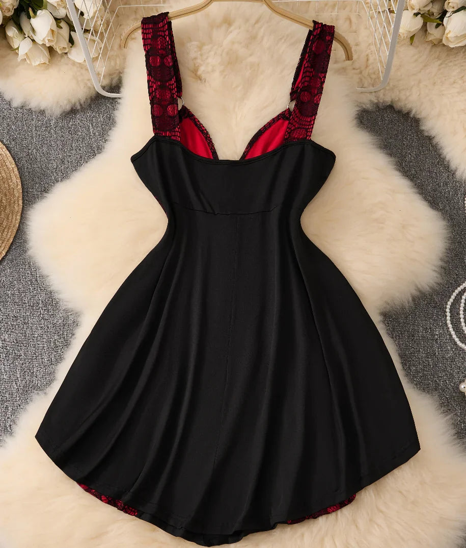 Back view of a black and red gothic punk style sleeveless dress with lace panels.