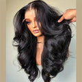 A mannequin head wearing a long black wavy lace front wig.
