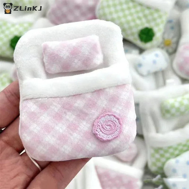 Small pink gingham plush sleeping bag accessory for miniature figurines