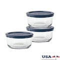 Set of three round glass food storage containers with blue lids