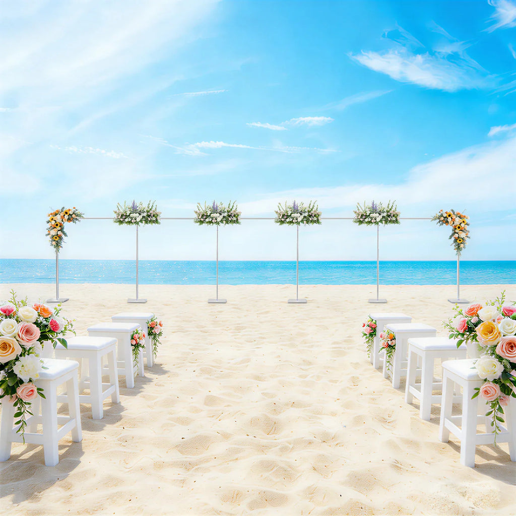 Wedding arch backdrop stand decorated with flowers on a beach