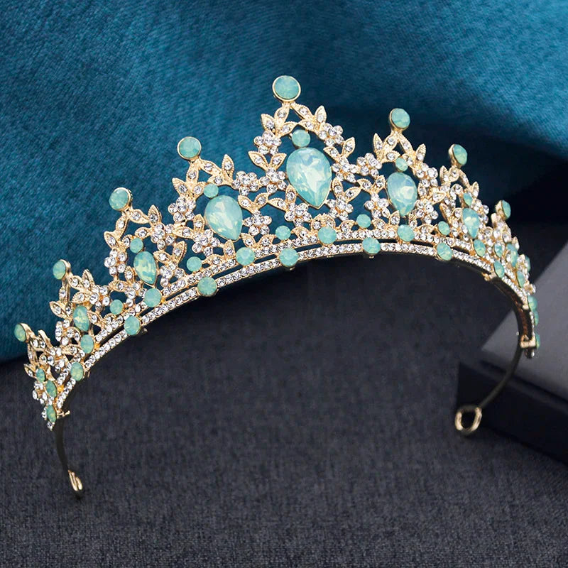 Gold tiara with light green teardrop and round rhinestones