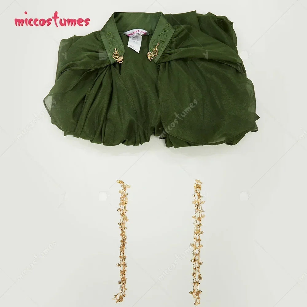 Flat lay of a green hooded cape and detachable gold chain fringe accessories