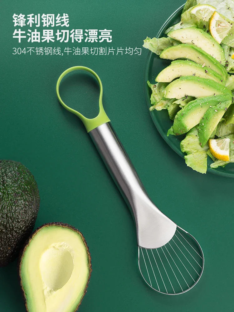 Stainless steel avocado wire slicer with green handle next to sliced fruit