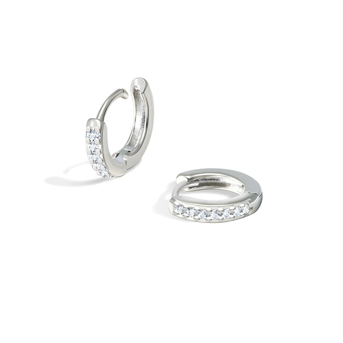 Two small silver hoop earrings with clear crystals.