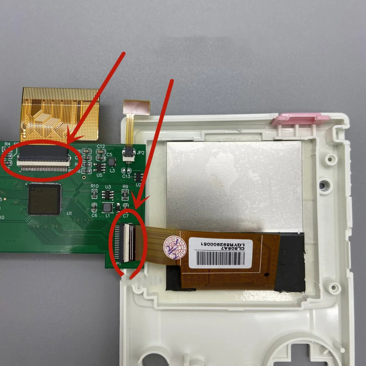 Installation guide showing LCD screen ribbon cable connection to PCB circuit board