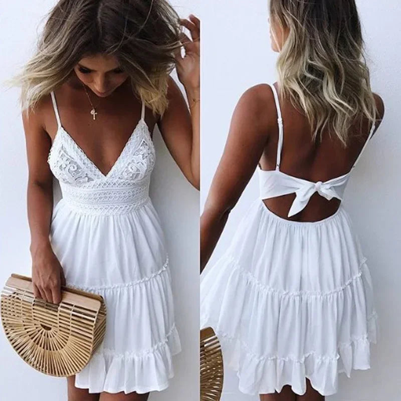 White sleeveless mini dress with lace bodice, spaghetti straps and open back with tie