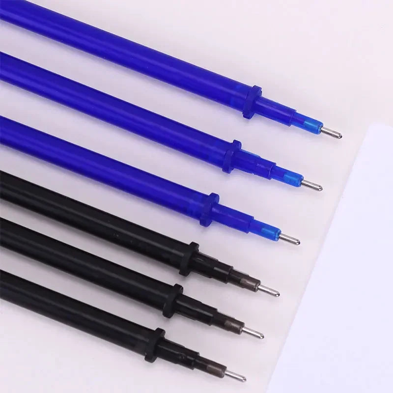 Close-up of blue and black gel pen ink refills with metal tips