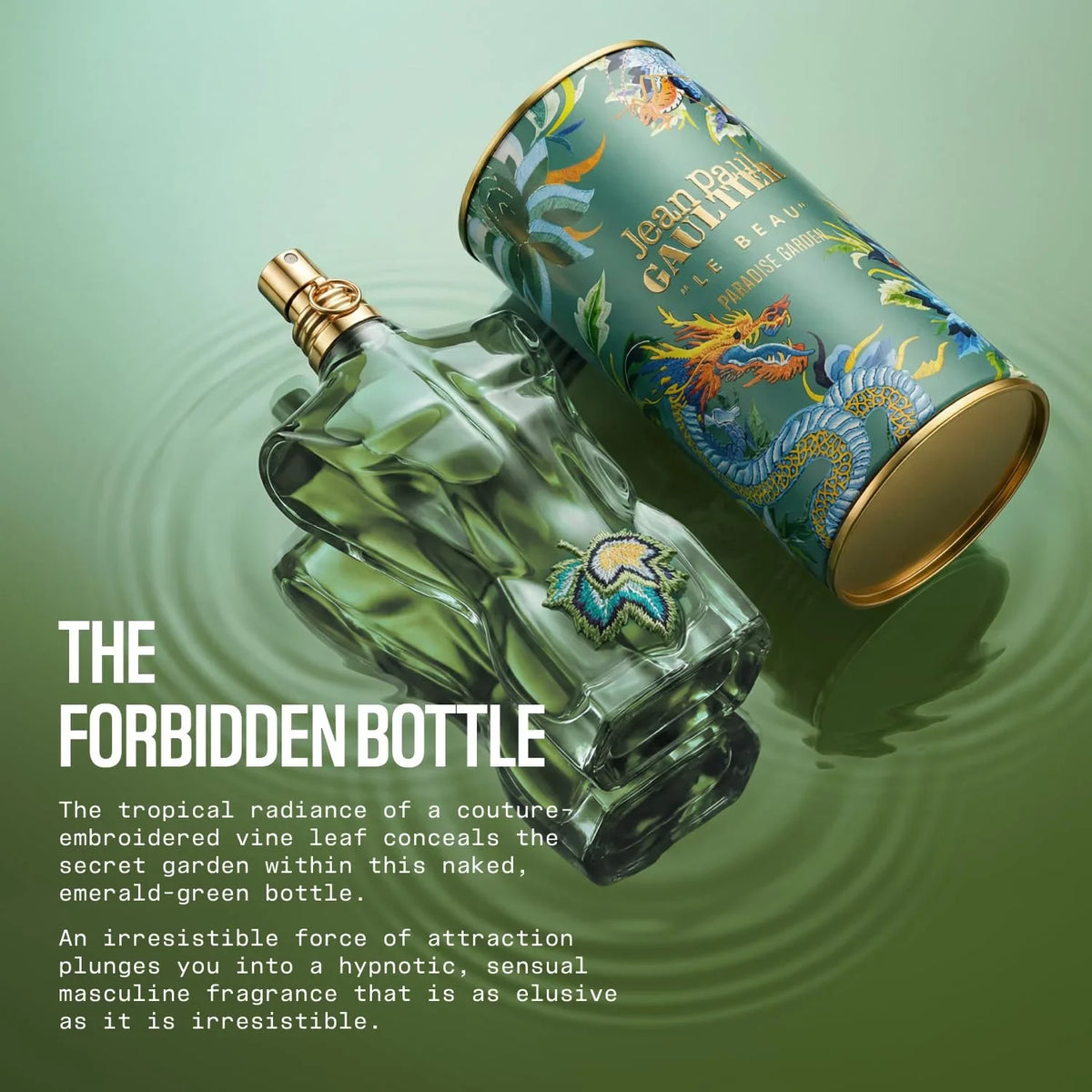 Torso shaped green perfume bottle lying on a water surface next to its matching decorative tin