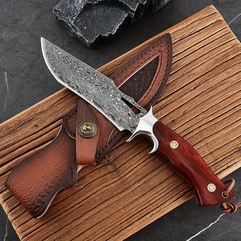 Damascus steel knife with a wooden handle resting on a leather sheath and a wooden board