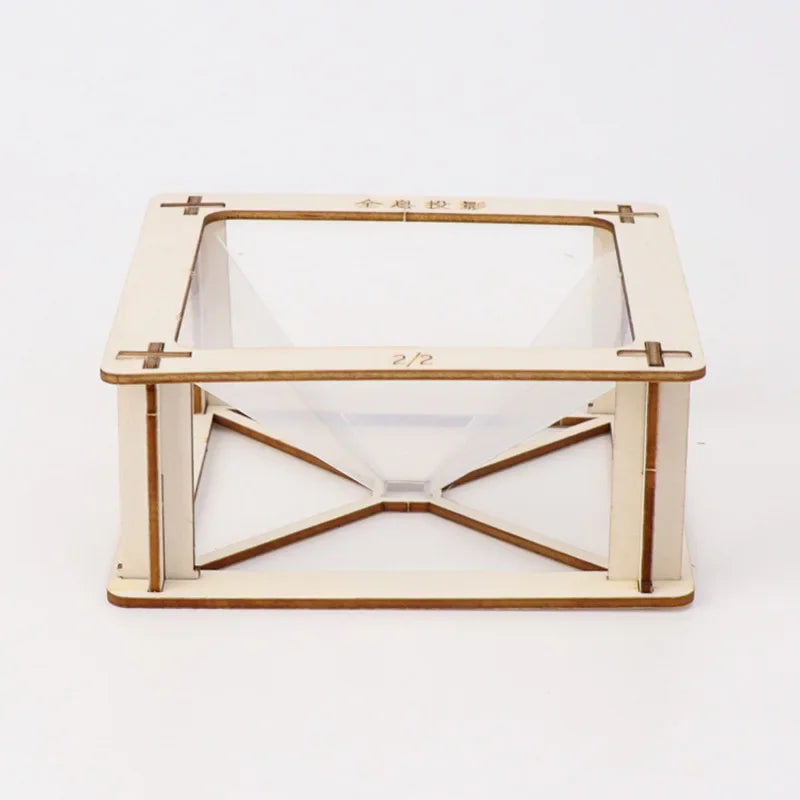 Assembled wooden 3D holographic projection pyramid stand on a plain white background