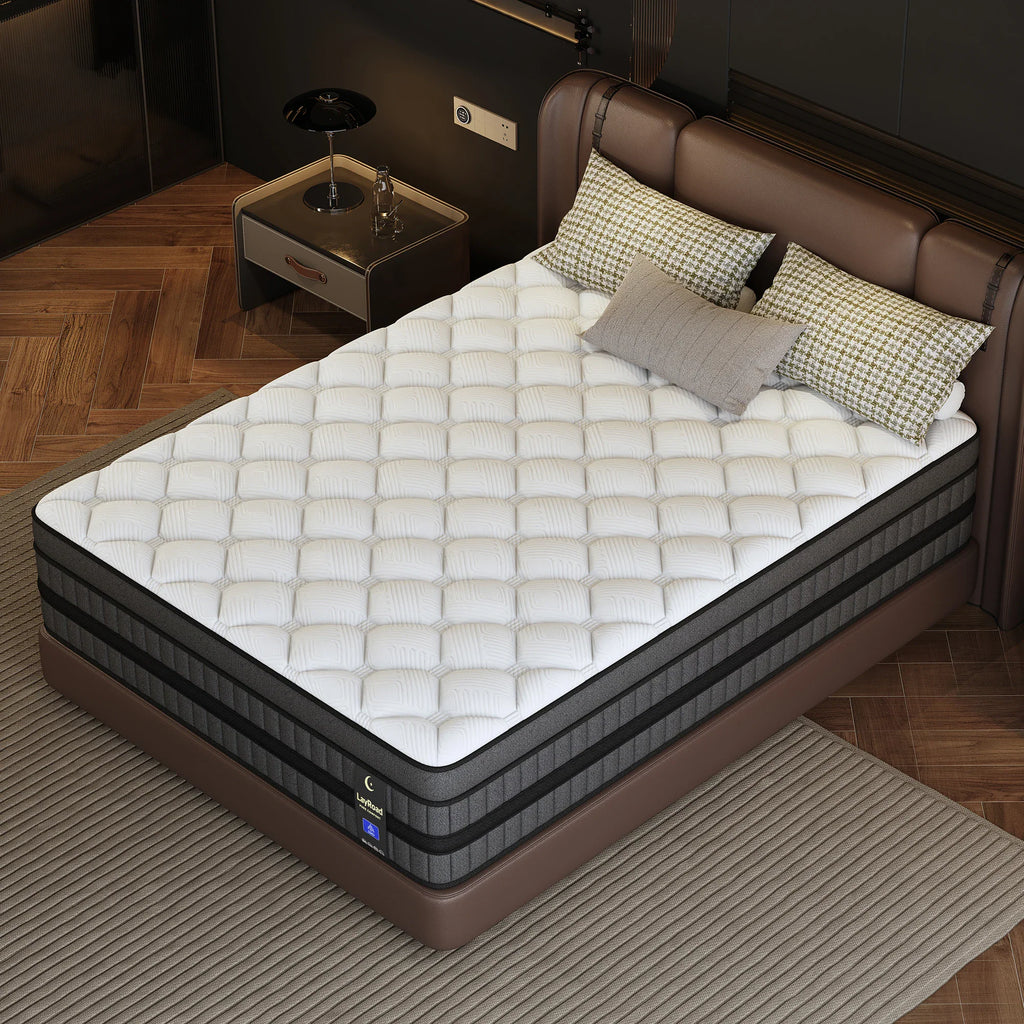 High-angle view of a hybrid mattress with grey fabric sides and a white quilted top