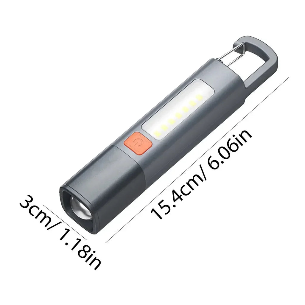 Grey handheld LED flashlight with length and width dimensions in centimeters and inches