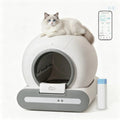 Smart self-cleaning cat litter box with a white cat on top and smartphone app control interface