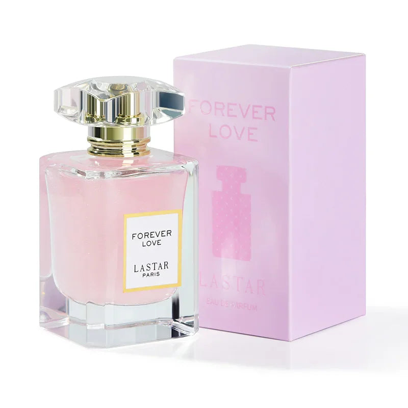 Pink perfume bottle with a glass cap next to its matching light pink box packaging