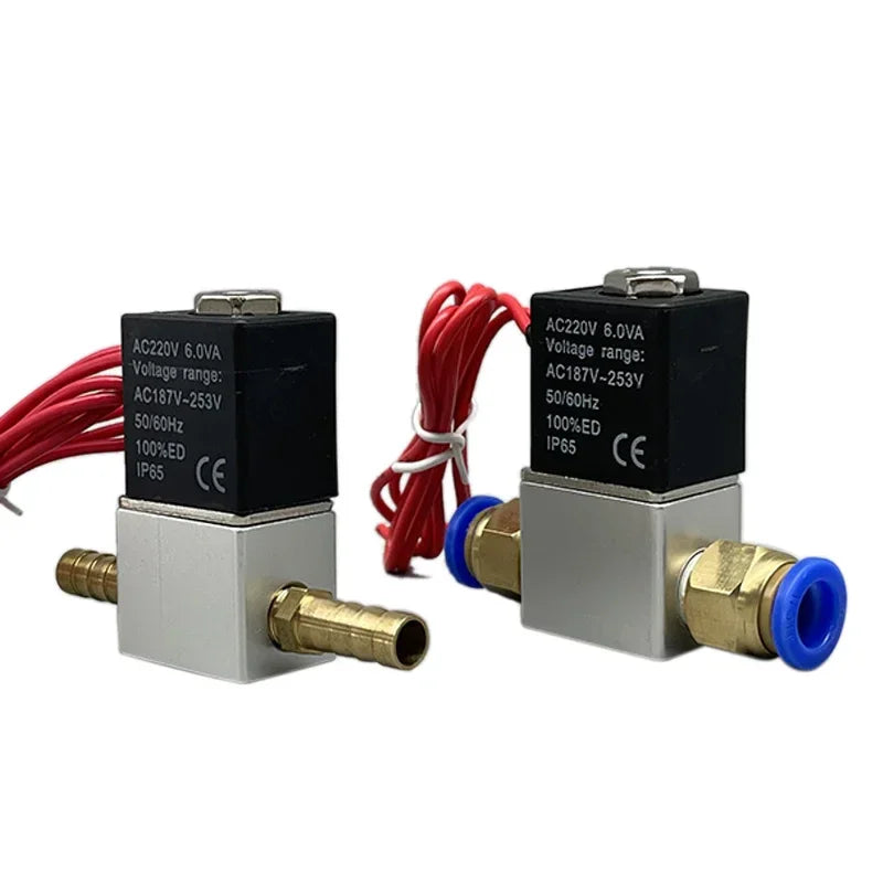 Two electric solenoid valves with brass hose barbs and red wires
