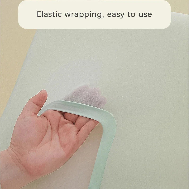 A close up of a hand showing the elasticated edge of a light green pillowcase