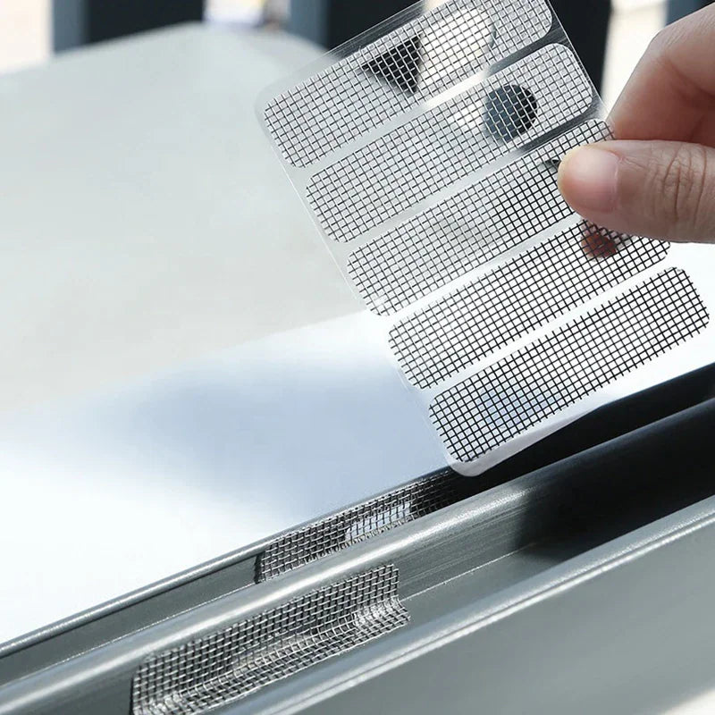 Hand applying rectangular self-adhesive mesh patches to a metal window frame