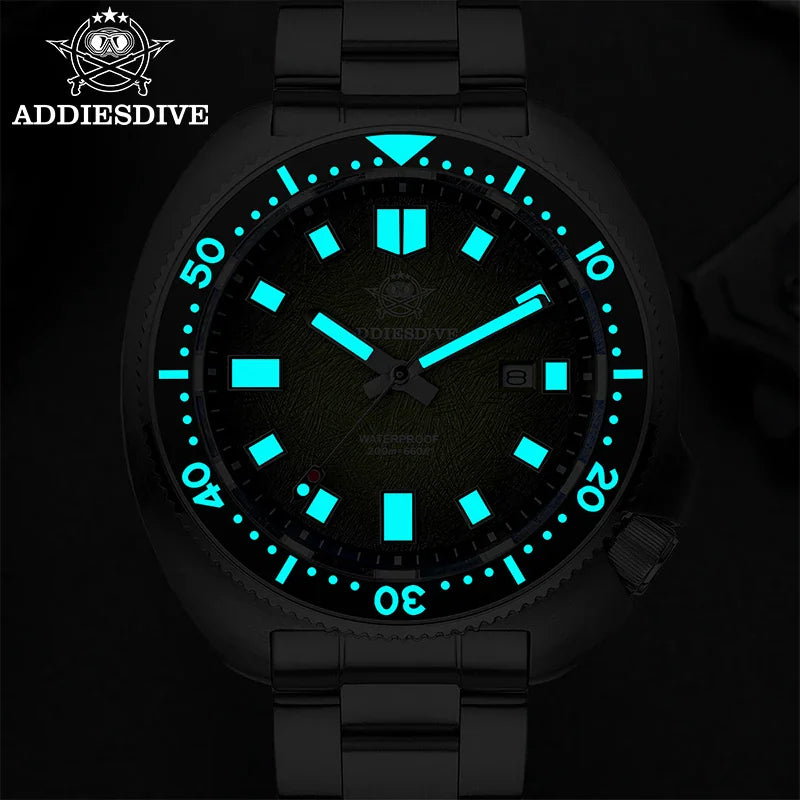 Diver watch in the dark showing bright blue luminous hands and indices