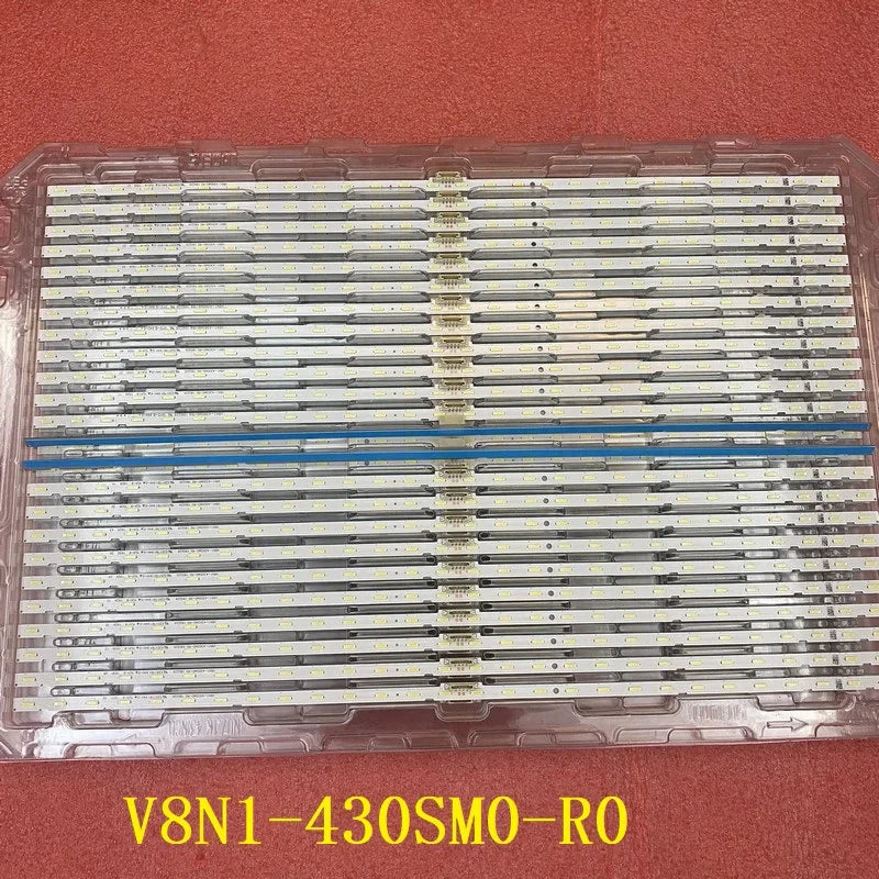 Full view of a plastic tray containing many LED backlight strips for television display repair