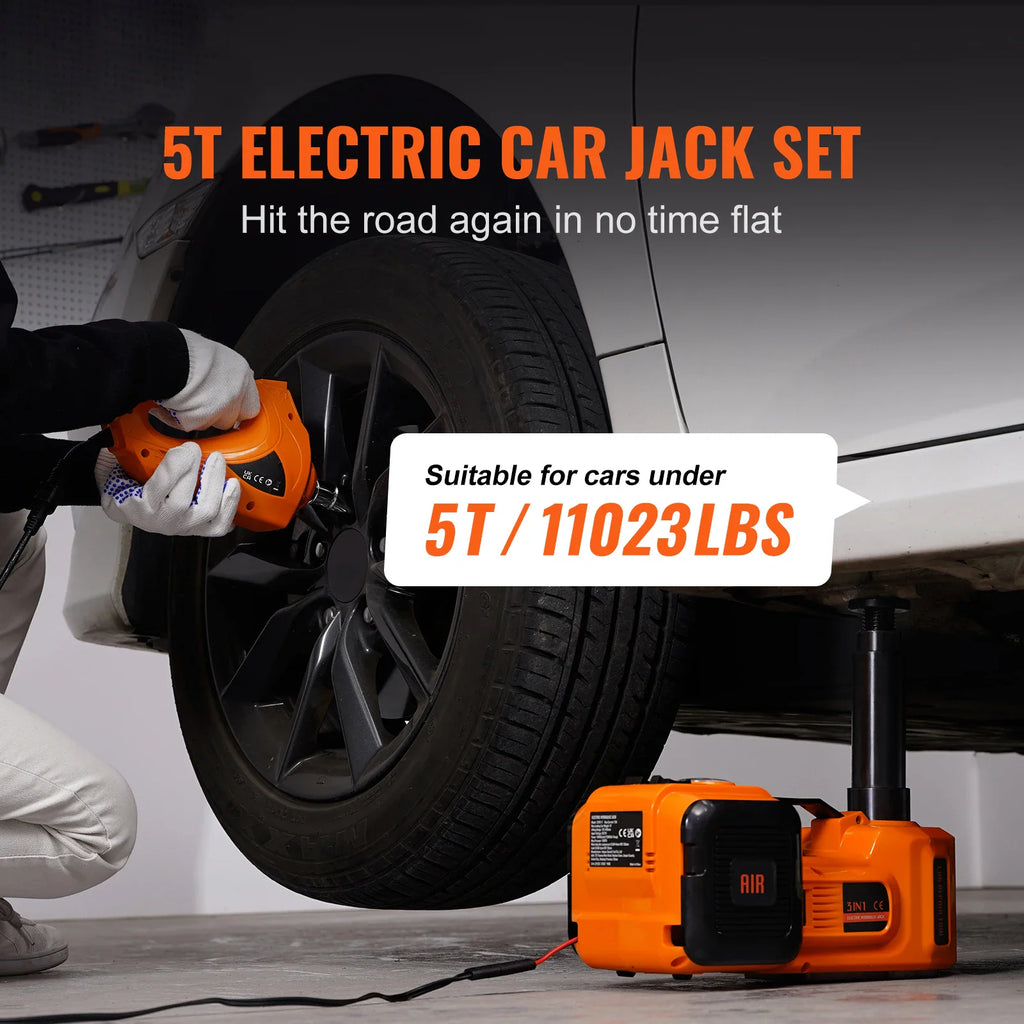 Person using an orange electric car jack and impact wrench to change a car tire