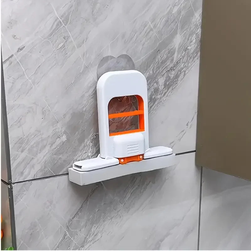 Handheld mini mop mounted on a bathroom wall tile