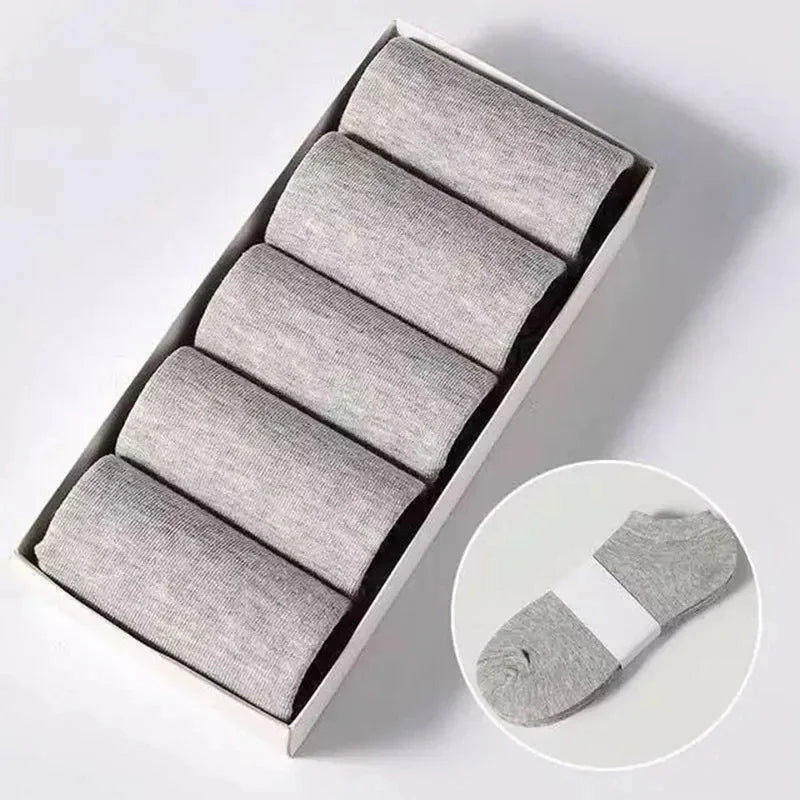 Five pairs of grey ankle socks in a box with an inset photo of a single bundled pair.