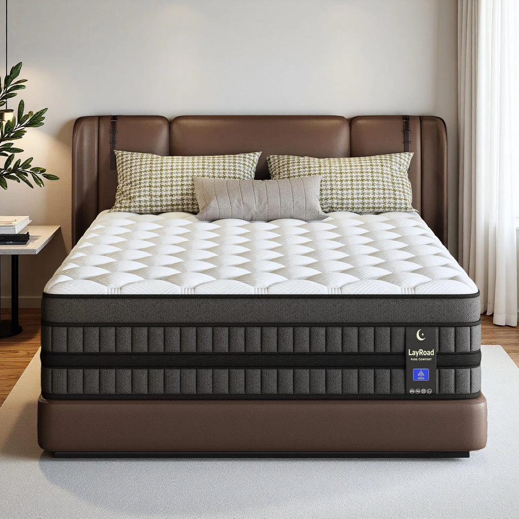 Full-size hybrid mattress with white tufted top and grey sides in a bedroom setting