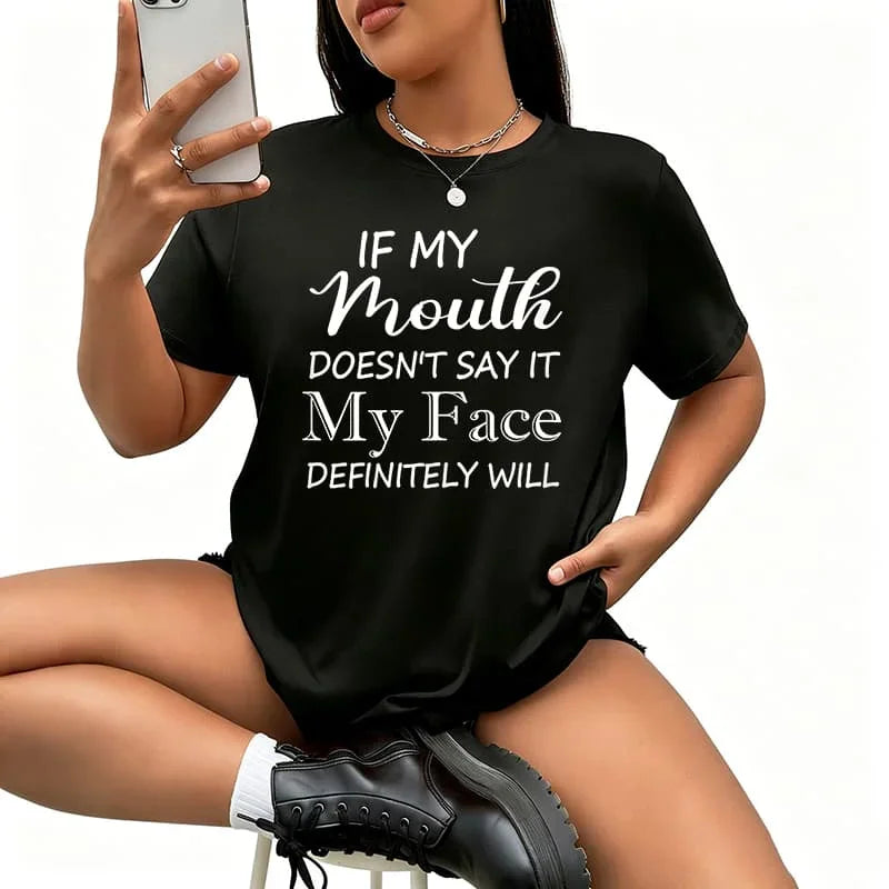 A woman wearing a black short-sleeved t-shirt with white text reading: If my mouth doesn't say it my face definitely will.