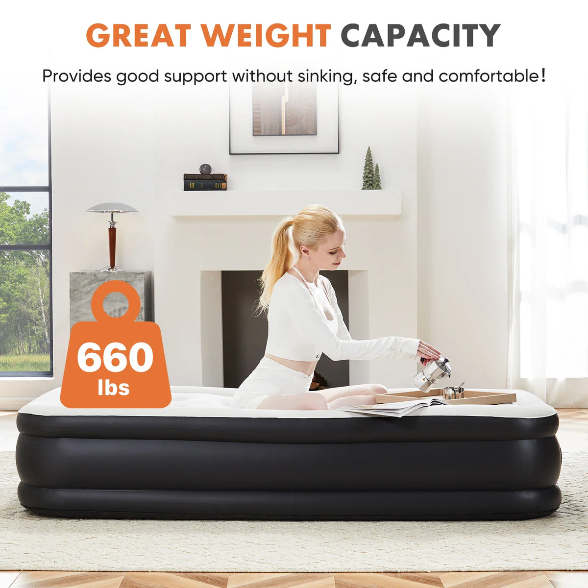 A woman sitting on a durable 660 lbs weight capacity black and white air mattress.