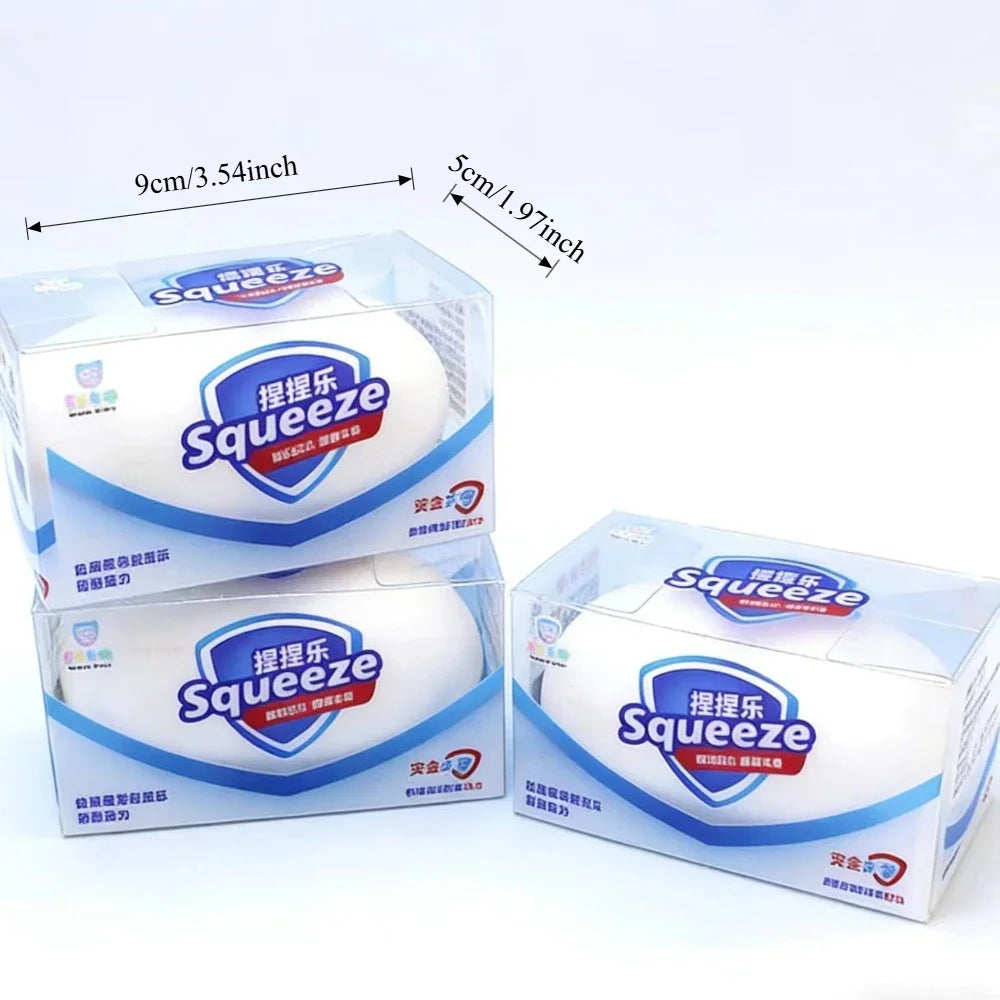 Three boxes of white soap-shaped stress relief squishy toys with size dimension labels