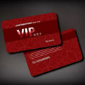 Red patterned VIP membership card with gold text and numbered identity