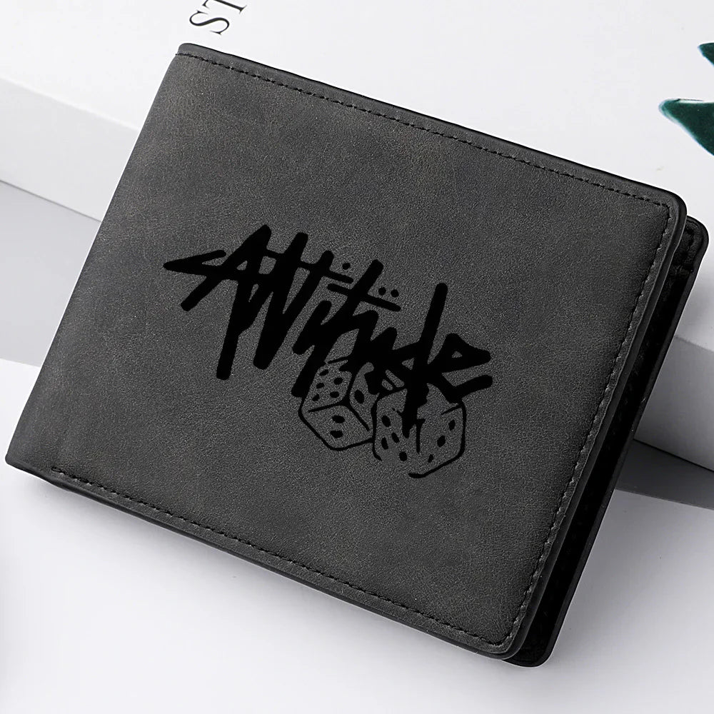 Black bi-fold leather wallet with dice and attitude text print