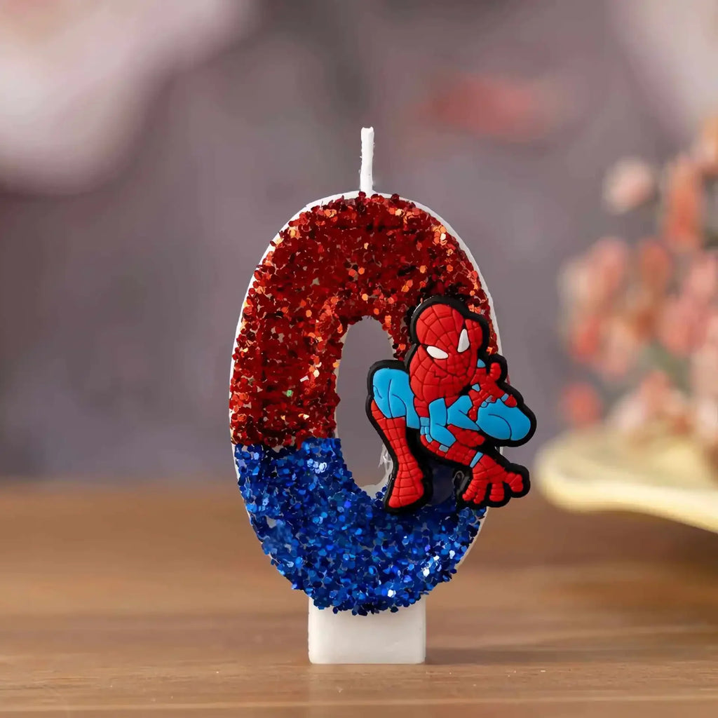 Number 0 birthday candle decorated with red and blue glitter and a cartoon superhero figure