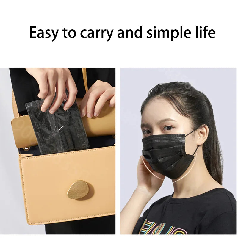 Person carrying a black face mask in a purse and wearing one