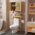 Bamboo over-the-toilet storage unit with an open cupboard door, showing internal shelving.