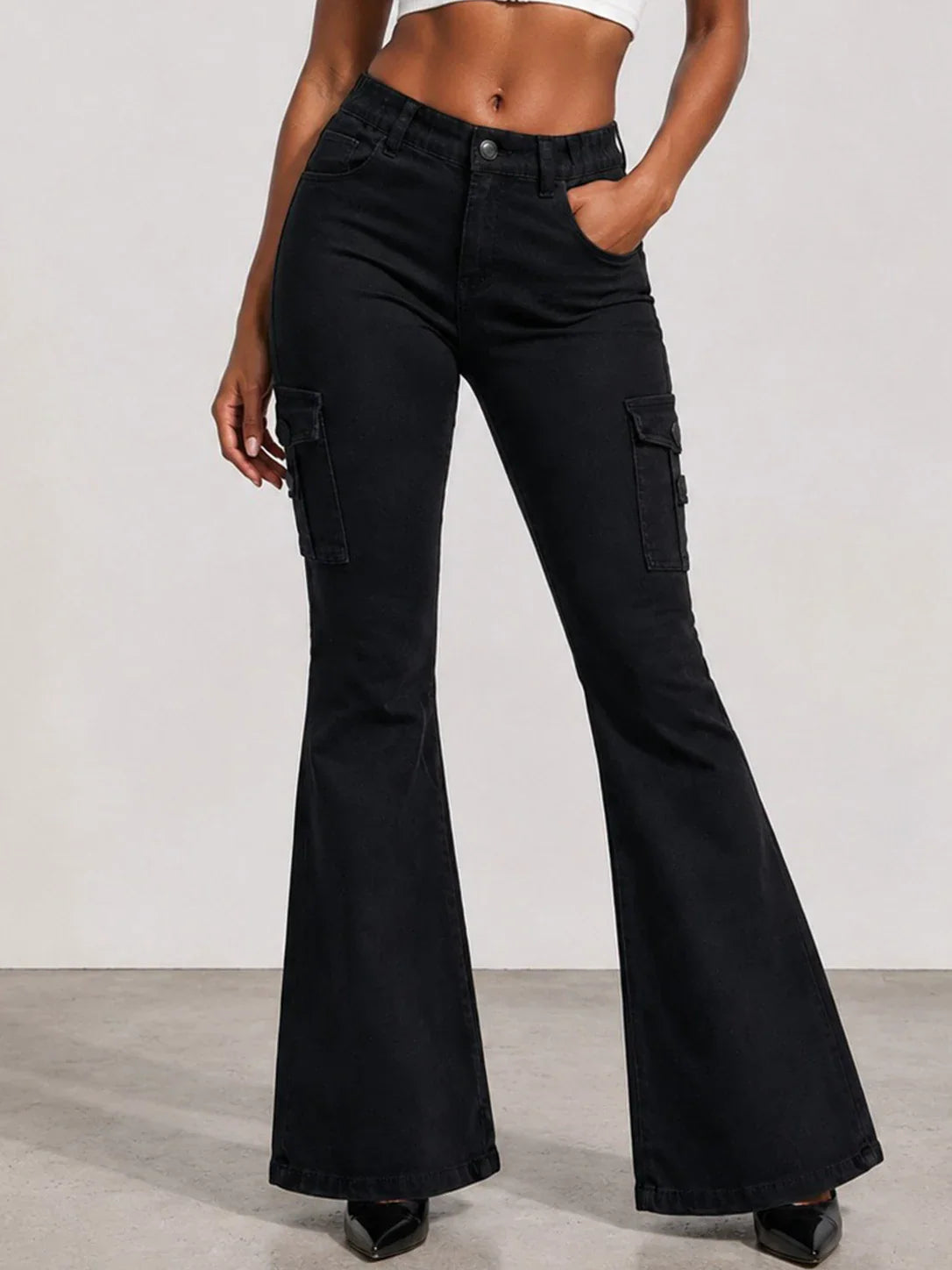 Black cargo flare jeans worn by a model.