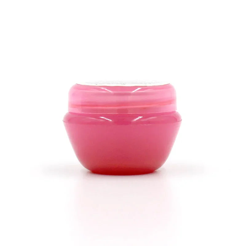 Side view of pink pot of eyelash extension glue remover